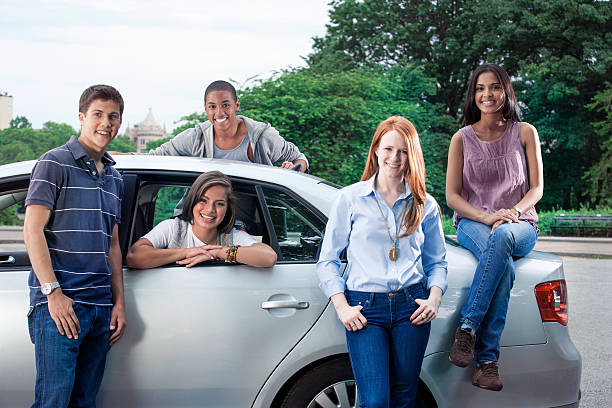 istock Teenagers with car 540968774