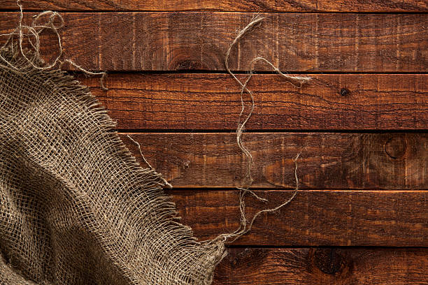 istock Old hessian texture on wooden table, top view 540968976