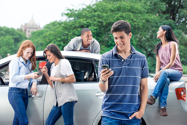 istock Teenagers with car 540969592