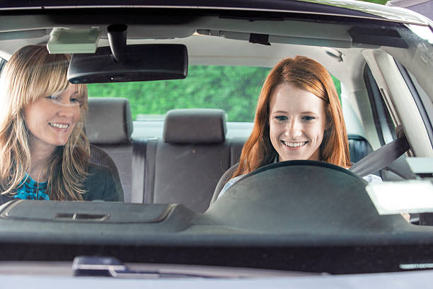 istock Teenager in car with driving instructor 540970176