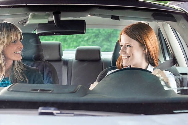 istock Teenager in car with driving instructor 540970346
