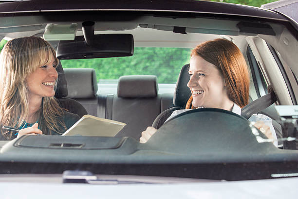 istock Teenager in car with driving instructor 540970442