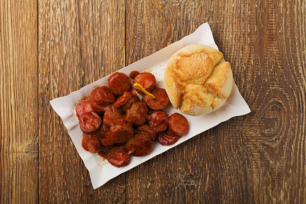 istock Traditional German currywurst, served on disposable paper tray w 540971878