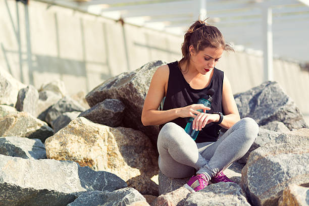 istock Woman resting after training outside at the beach 540972244