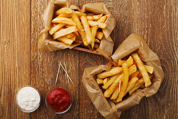 istock Serving Belgian fries served in a paper box. 540972920