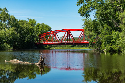 Red wooden bridge in a park