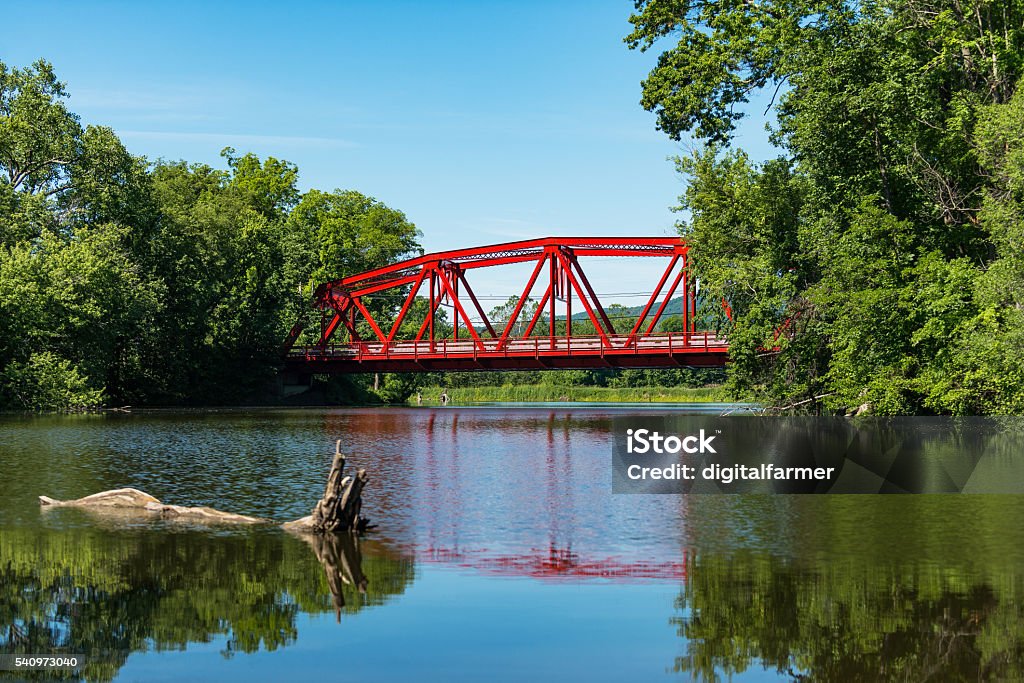 Red Bridge in bright daylight over the Wallkill River. Red Bridge in bright daylight on Route 32 over the Wallkill River near Rifton in Upstate New York. New York State Stock Photo