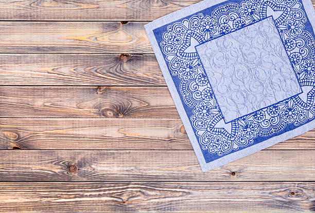 istock Blue napkin on wooden table, top view 540973588