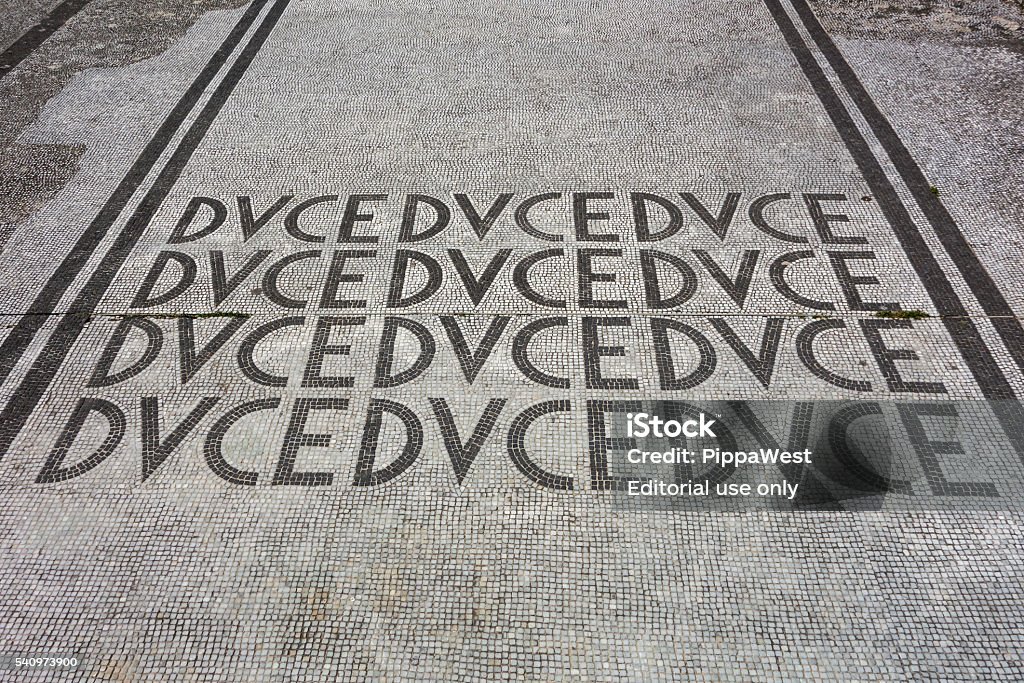 Duke Mussolini Mosaic Rome, Italy - April 5, 2015: Mosaic paving with the words DUCE, nickname of Mussolini, at the Foro Italico. Benito Mussolini Stock Photo