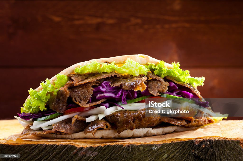 Beef Kebab in a bun Beef Kebab in a bun on woodboard Beef Stock Photo