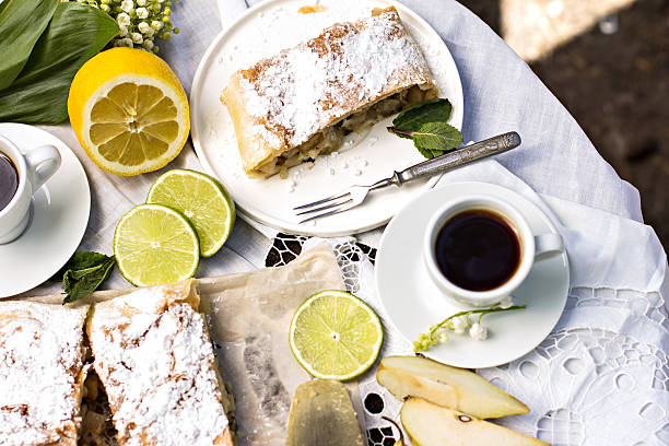istock pie, strudel with pear and lemon. Cup of coffee. 540974676