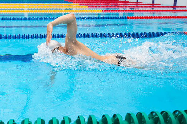 istock Man swimmer swimming crawl in blue water. 540976088