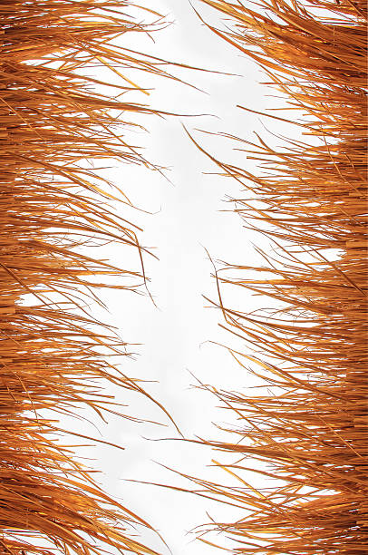 istock Top of yellow hut straw pattern on white background 540976150