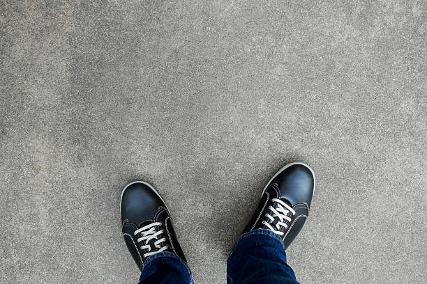 istock Black casual shoes standing on concrete floor 540976152