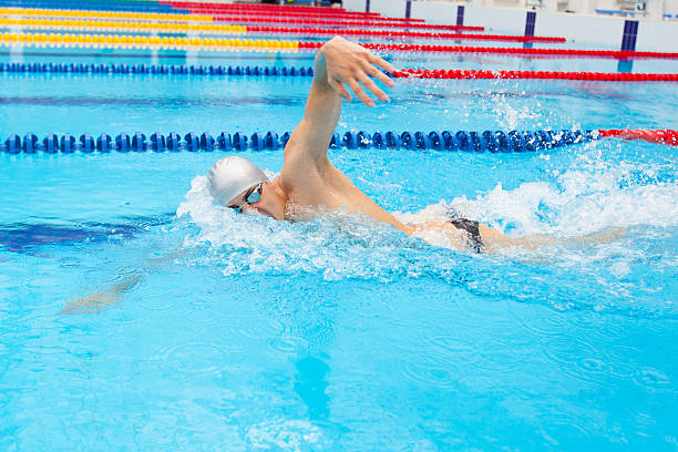 istock Man swimmer swimming crawl in blue water. 540976212