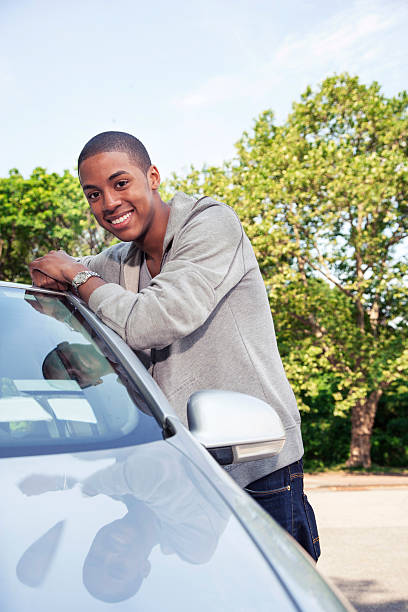 istock Teenagers with car 540976370