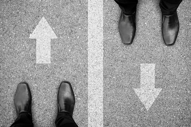 istock Two men standing on different side of the road 540976980