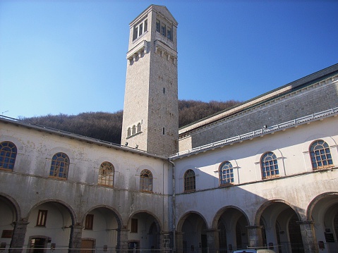 Mercogliano, Avellino, Campania, Italy - January 10, 2007: The inner courtyard of the ancient basilica, behind, bell tower and the nave of the New Basilica.