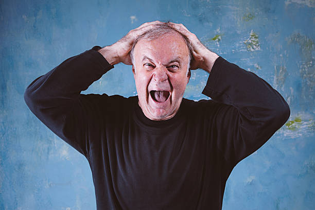 istock Portrait of screaming senior man 540977730