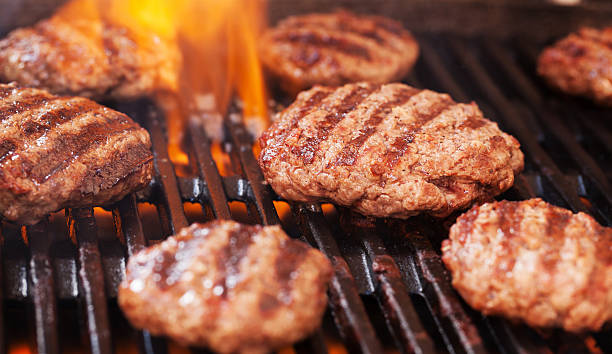 istock Burgers cooking on grill 540978170