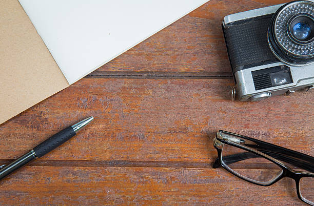 istock Overview desk of creative with notebook,glasses,pen and camera 540978630