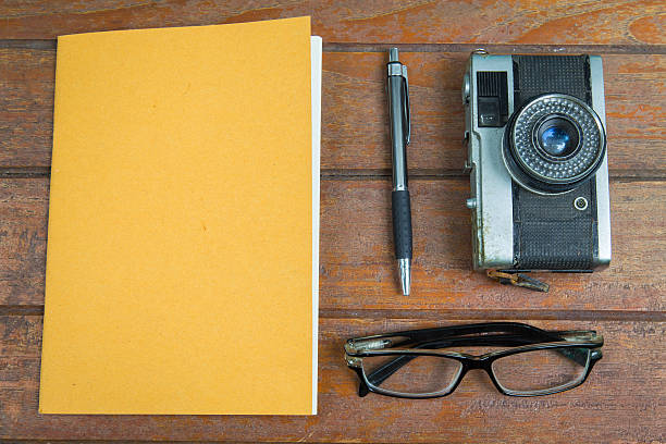 istock Overview desk of designer with notebook,glasses,pen and camera 540979016