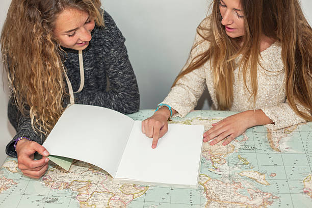 istock Girl helping little sister with her homework 540982440