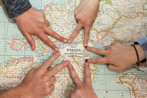 istock Different hands drawing a star pointing Europe in world map 540983456
