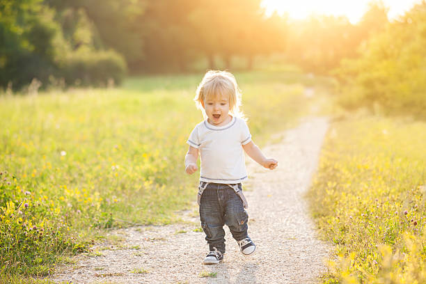 istock Happy little boy running outside 540985166