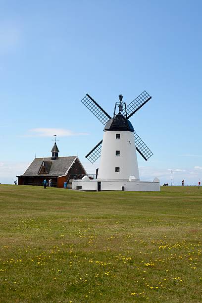 Lytham Windmill Lytham, United Kingdom - June 18, 2016: Lytham windmill on a sunny day sited at Lytham Green, 6 members of the public can be seen, Lytham St Annes, Lancashire, UK lytham st. annes stock pictures, royalty-free photos & images