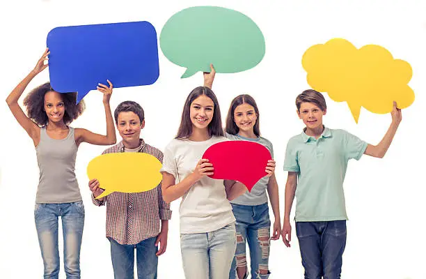 Photo of Teenagers with speech bubbles