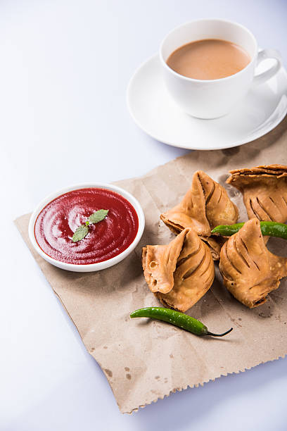 istock Samosa snack with tomato ketchup and hot tea 540994588