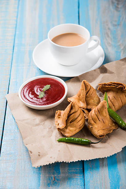 istock Samosa snack with tomato ketchup and hot tea 540994750