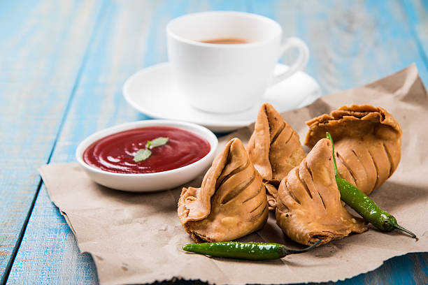 istock Samosa snack with tomato ketchup and hot tea 540994816