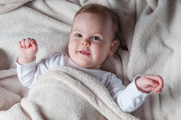 istock Beautiful little girl lying on her back and posing 540994836