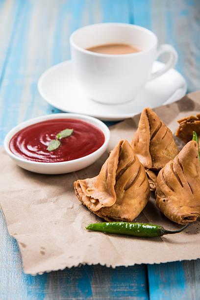 istock Samosa snack with tomato ketchup and hot tea 540994874