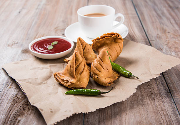 istock Samosa snack with tomato ketchup and hot tea 540995494