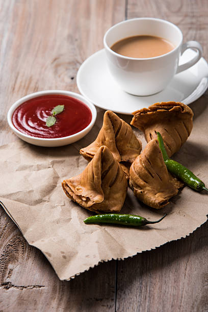istock Samosa snack with tomato ketchup and hot tea 540995598