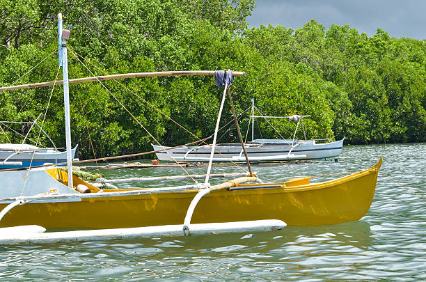 foto di tre barche da pesca in legno - nautical vessel philippines mindanao palawan foto e immagini stock