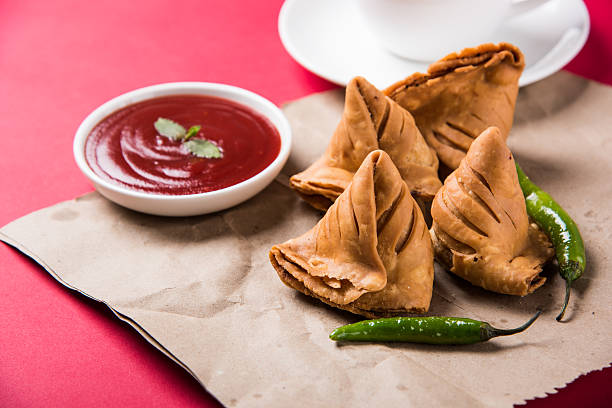 istock Samosa snack with tomato ketchup and hot tea 540996000