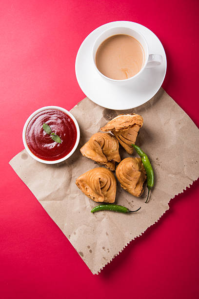 istock Samosa snack with tomato ketchup and hot tea 540996116