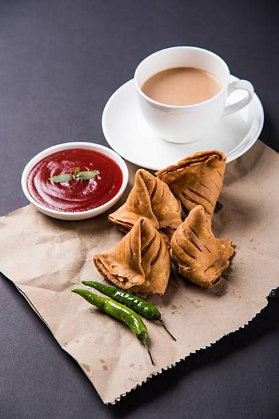 istock Samosa snack with tomato ketchup and hot tea 540996188