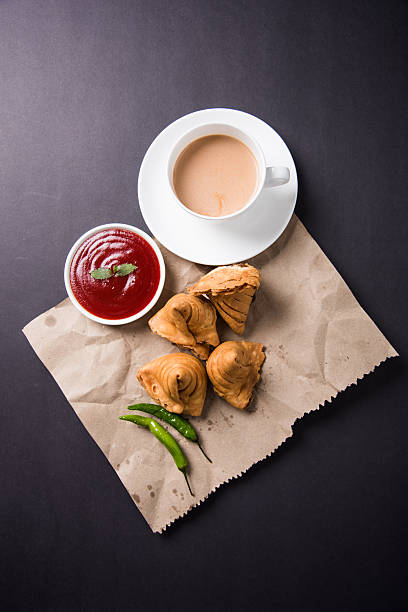 Samosa snack with tomato ketchup and hot tea