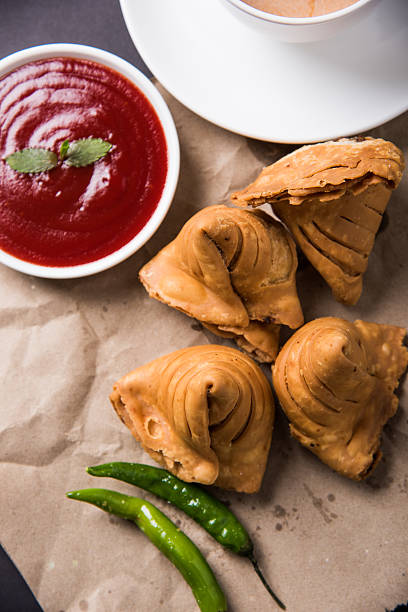istock Samosa snack with tomato ketchup and hot tea 540996766