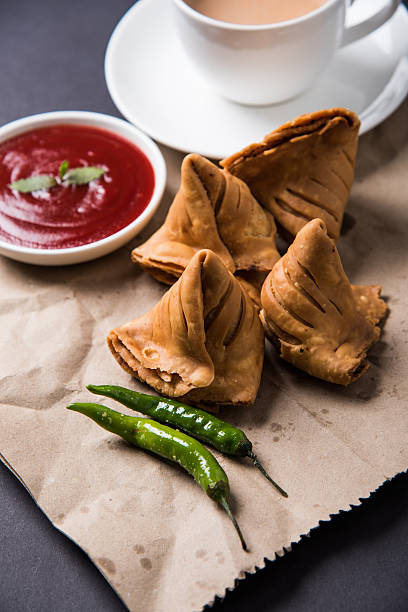 istock Samosa snack with tomato ketchup and hot tea 540996864