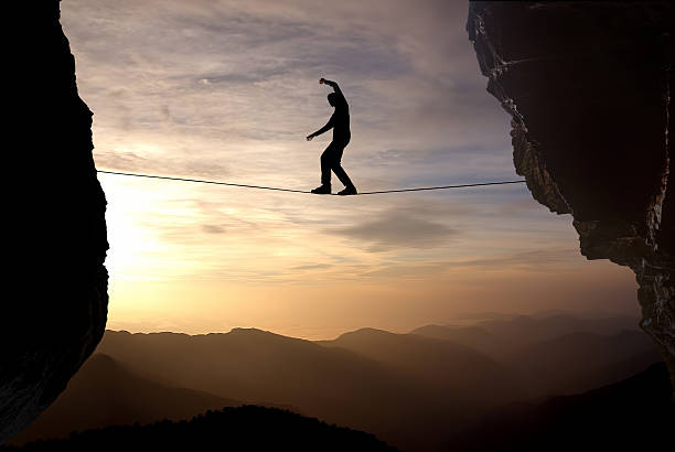 istock Man balancing on the rope concept of risk taking 540997926