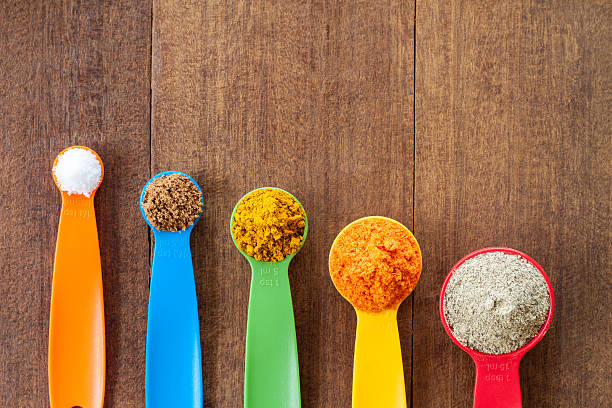istock Various colorful spices on wooden table 540998884