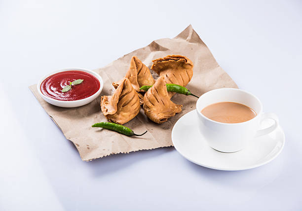 istock Samosa snack with tomato ketchup and hot tea 540999008