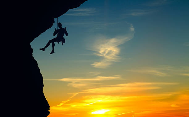 istock Silhouette of Rock Climber at Sunset 540999326