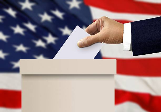 istock Ballot box with person hand casting a vote 541000070
